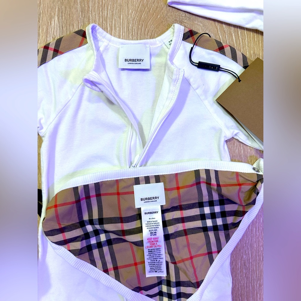 Burberry onesie (12 months ) with hat and bib , including bag.